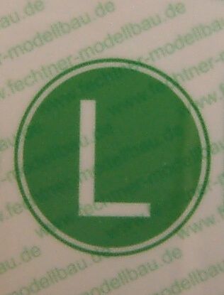 L-platta grön / vit 1 / 8 underteckna "tystgående lastbilar"