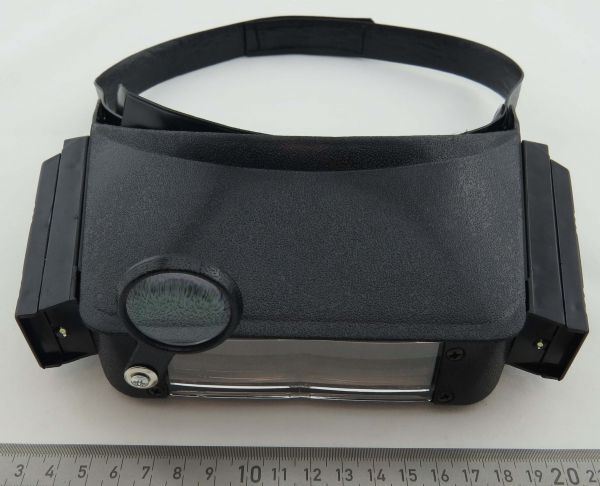 Headband magnifier with LED light. A useful helper for