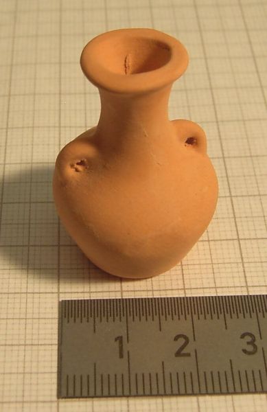 1x clay jug with 2 handles 4cm high. Terracotta-colored