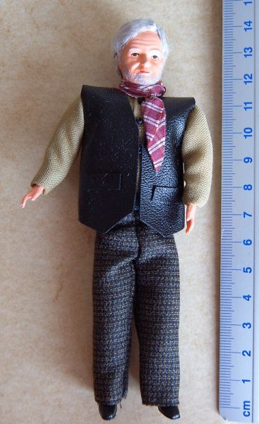 1x Flexible Doll Trucker about 14cm high with leather vest, scarf