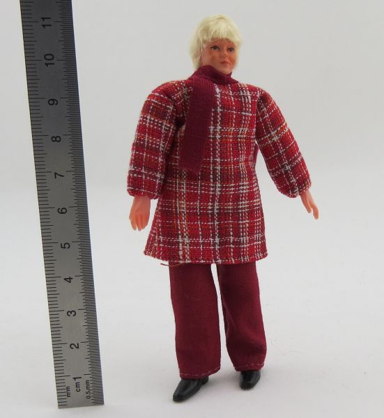 Flexible doll truck driver with long blond hair, around 117