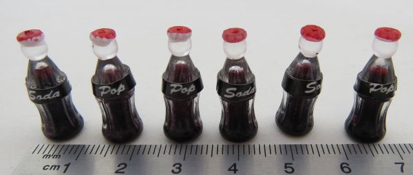 bottle of coke. Approx. 22mm height. Approx. 9mm diameter. Of course