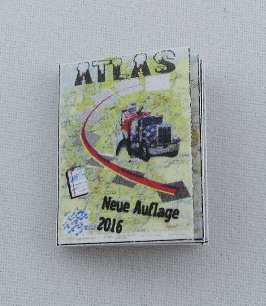 Miniature tijdschrift "Travel Atlas" als de belichaming