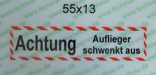 Text skylten "Attention Auflie.schwenkt" själv