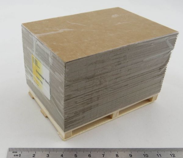Pallet with gray cardboard. Model cargo. Gray board on