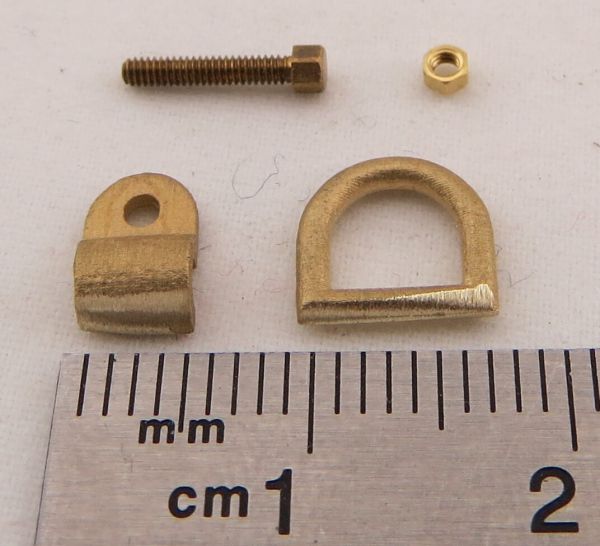 D-ring with mounting hardware, brass investment casting. Finished