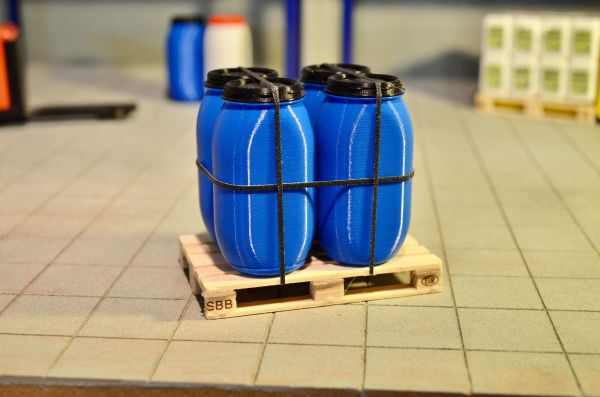 4 wide-necked barrels on Euro pallet blue with black